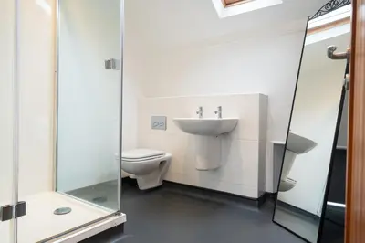 a bathroom with a sink and a toilet at Weirside, Chapel Stile in Ambleside