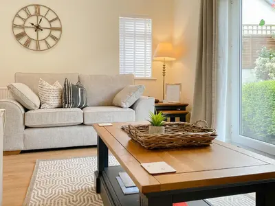 a living room with a couch and a table at Oakvale - Acorn in Braithwaite