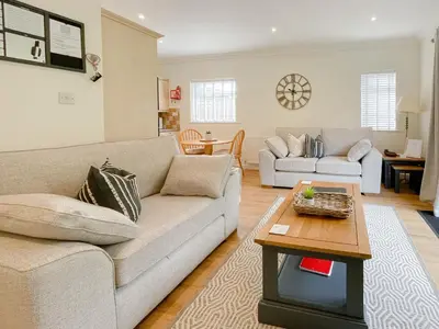 a living room with a couch and a table at Oakvale - Acorn in Braithwaite