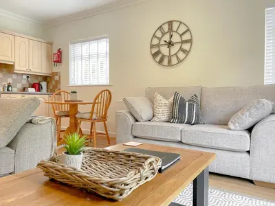 a living room with a couch and a table at Oakvale - Acorn in Braithwaite