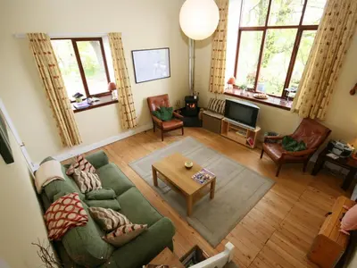 an overhead view of a living room with a couch and a table at Rowan Cottage in Borgue