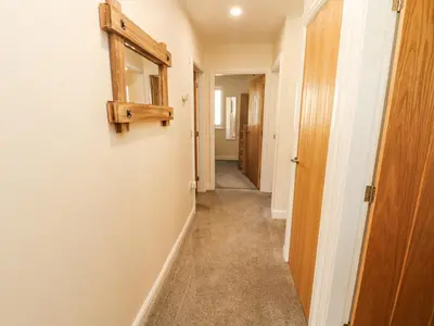 an empty hallway with a hallway at Squirrel Cottage in Penrith