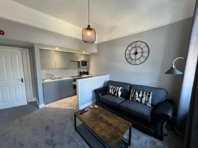 a living room with a couch and a table at The Globe Apartments and Bedrooms in Cockermouth