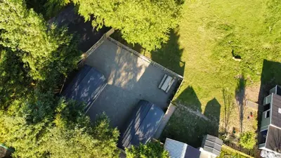 an overhead view of a house with a driveway at little peru luxury pods and alpaca farm in Crosshill