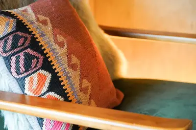 a close up of a cushion on a chair at Glencartholm Farm by Wigwam Holidays in Canonbie