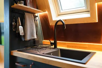 a kitchen counter with a sink and a window at Glencartholm Farm by Wigwam Holidays in Canonbie