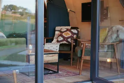 a room with a table and a chair and a window at Glencartholm Farm by Wigwam Holidays in Canonbie