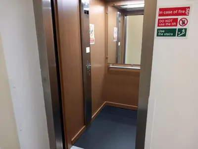 an elevator in a building with a sign on the door at Harbour View - 1 Bedroom - Sleeps 2 in Whitehaven