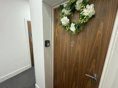 a door with a wreath on it with a number on it at Harbour View - 1 Bedroom - Sleeps 2 in Whitehaven