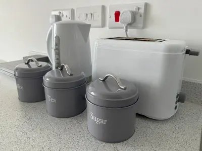 a kitchen counter with four pots and a toilet at Harbour View - 1 Bedroom - Sleeps 2 in Whitehaven