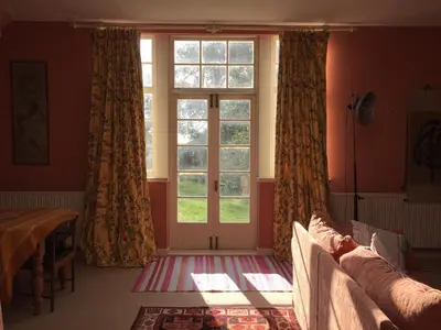 a room with a large window and a bed and a window at Gilchristland Organic Farm Retreat in Closeburn