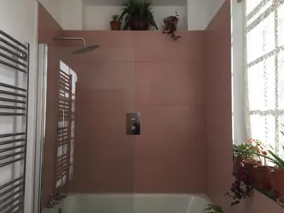 a bathroom with a bath tub in a room at Gilchristland Organic Farm Retreat in Closeburn