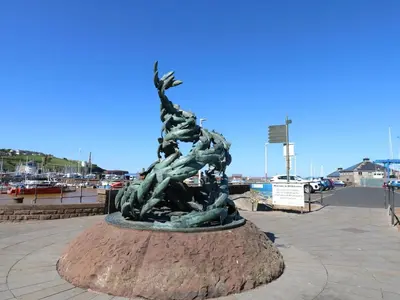 a statue of two people standing on a mound at Sea View Apartment - 2 Bedrooms - Sleeps 4 in Whitehaven