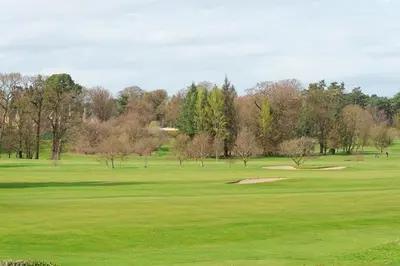 a golf course with a green field and trees at Brig o Doon 2 in Ayr
