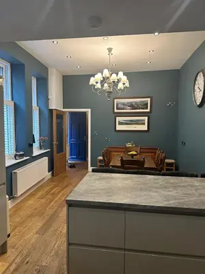 a kitchen and living room with a dining room at Cumberland House in Cockermouth