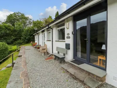 a building with a row of benches outside of it at Bluebells in Ambleside