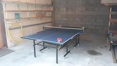 a ping pong table in a garage with at Braesyde in Kippford
