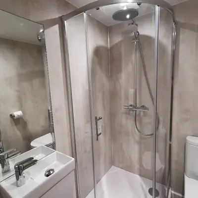 a bathroom with a shower and a sink at The Swinside Inn in Keswick