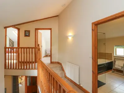 a staircase in a house with a glass door at Gallery Cloisters in Keswick