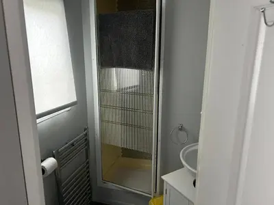 a bathroom with a shower and a sink at Cairnryan Heights home from home in Cairnryan