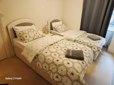two beds in a small room withskirts at Douglas Head Road in Douglas