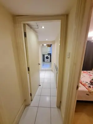 a hallway leading to a room with a bedroom at Douglas Head Road in Douglas