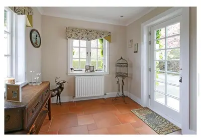 a living room with a table and a window at Brig o Doon House Alloway in Ayr