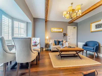 a living room with chairs and a table at Royal Aberdeen - Ukc6917 in Turnberry