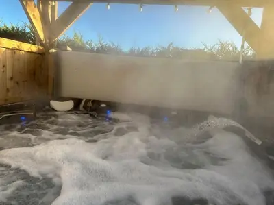 a bath tub filled with lots of snow at Bungalow with Hot Tub, BBQ Hut, Golf Net , Large Garden & Play Area in Maybole