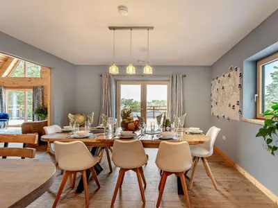 a dining room with a table and chairs at 4 Bed in Kippford 95234 in Kippford