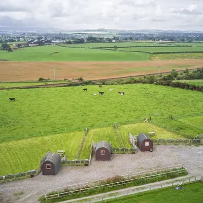 an aerial view of a field with a group of animals at Unit 4 - Skiddaw View Camping Pod in Carlisle