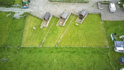 an overhead view of a group of cars on a field at Unit 4 - Skiddaw View Camping Pod in Carlisle
