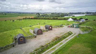 an aerial view of a farm with domes in a field at Unit 4 - Skiddaw View Camping Pod in Carlisle
