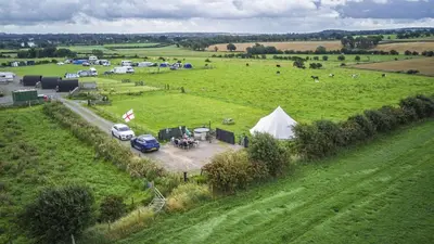 an aerial view of a field with a tent and cars at Unit 1 - Dolly Daydream Bell Tent in Carlisle