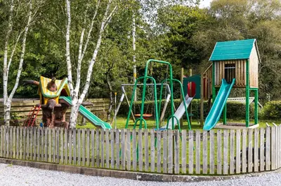 a park with a playground with a slide at The Kellbank in Gosforth