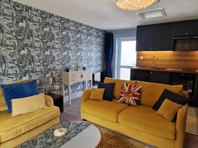 a living room with a couch and a table at The Den by Blake View Holidays a peaceful boutique retreat 3 miles from Ennerdale- standard twin or super-king bed available in Rowrah