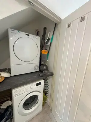 a laundry room with a washer and dryer in a kitchen at Chapel Terrace - 2 Bedrooms - Sleeps 4 in Cleator Moor