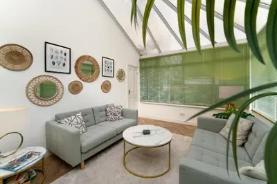 a living room with a couch and a table at Mansefield, Keswick - Sleeps 6 in Keswick