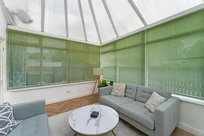 a living room with a couch and a table at Mansefield, Keswick - Sleeps 6 in Keswick