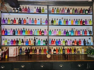 a bar with a lot of different types of bottles at Gosforth Hall Inn in Gosforth