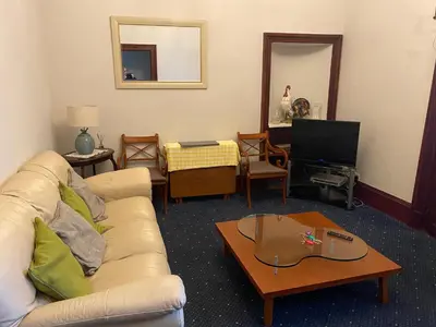 a living room with a couch and a coffee table at townhouse apartments in Ayr