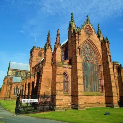 a large brick building with a gate in front of it at Ashley House, Carlisle in Carlisle