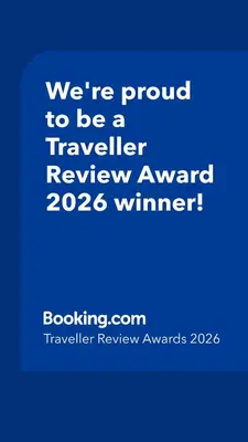 a blue sign that says were proud to be a traveller reviewagency winner at Ashley House, Carlisle in Carlisle