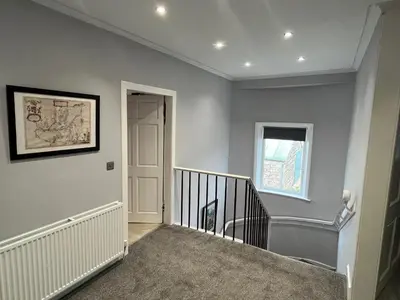 a staircase in a home with a stair case at Ryehill with Fishing in Sanquhar