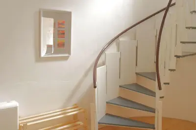 a staircase in a house with a glass railing at Stylish retreat in Langdale in Chapel Stile
