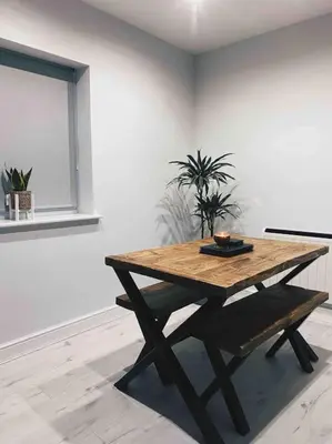a wooden table in a white room with a table sidx sidx sidx at Lakes Loft in Cockermouth
