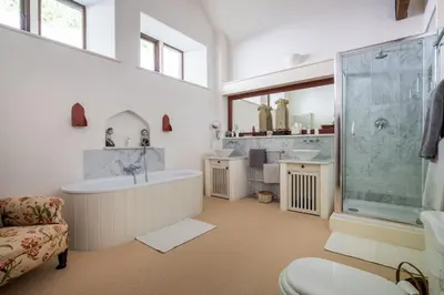 a large bathroom with a tub and a shower at Bank Barn, Wreay in Penrith