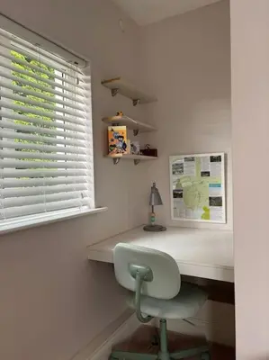 a desk with a chair in a room with a window at Cosy Cumbrian home away from home in Whitehaven