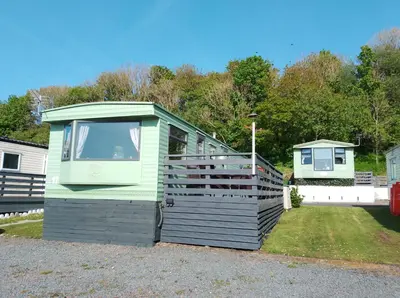 a small house sitting on the side of a yard at Cairnryan - Loch Ryan View in Cairnryan