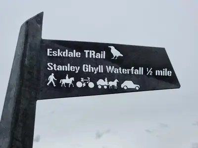 a sign for a train station with animals on it at 1 Bed in Eskdale 95105 in Eskdale